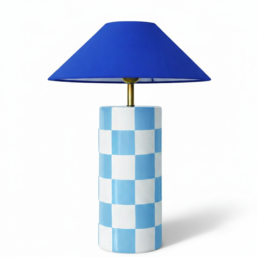Table lamp with blue checkered base and blue shade on a white background